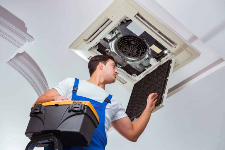bigstock-Worker-repairing-ceiling-air-c-196757827