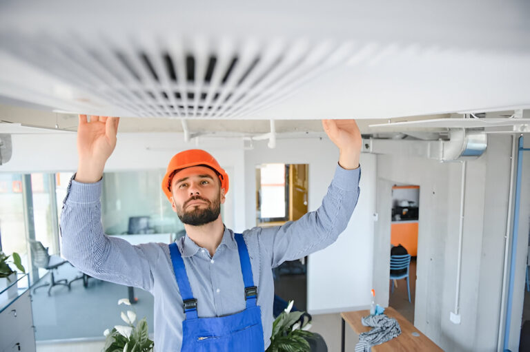 technician-service-checking-repairing-air-conditioner-indoors_255667-51673